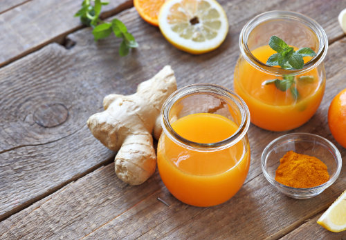 Happy,Woman,Taking,Out,A,Plate,Of,Berries,From,The